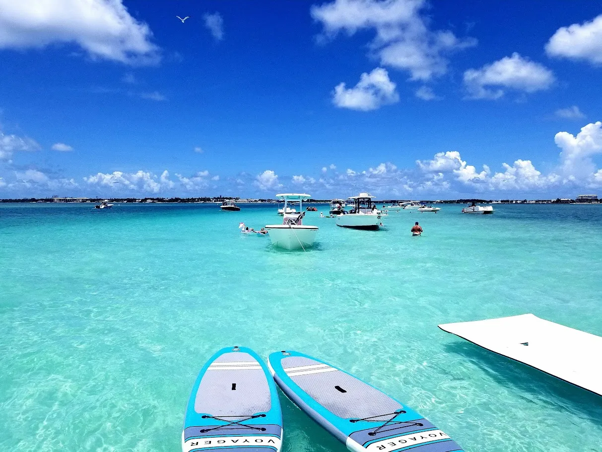 Several boats anchored at sandbar with paddle boards in Islamorada Fl
