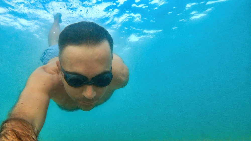 Man snorkeling underwater in clear Florida Keys ocean