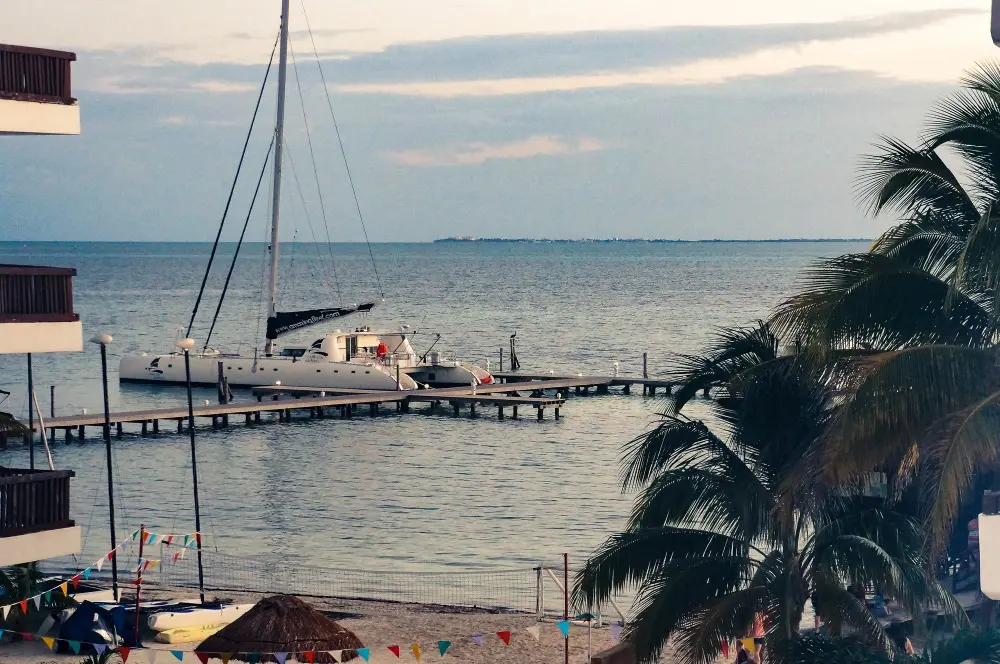 Luxury boat by a pier on the beautiful ocean near the beach